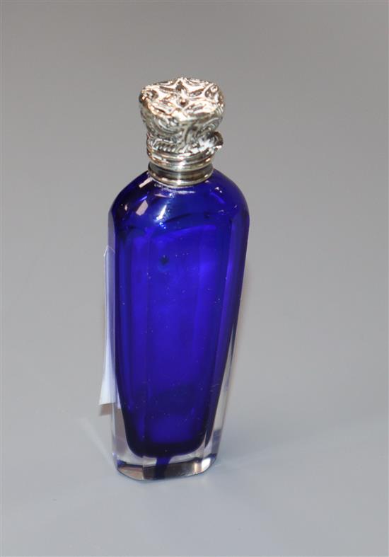 A Victorian white metal mounted blue glass scent bottle, 86mm.